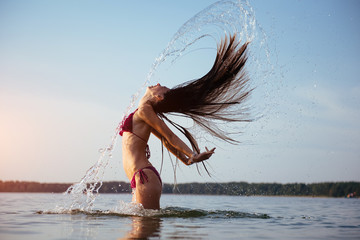 blonde woman on water background