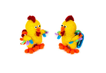 Knitted toy yellow cock with variegated tail. Amigurumi. Gift