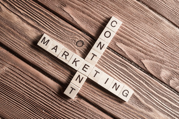 Conceptual business keywords on table with elements of game making crossword