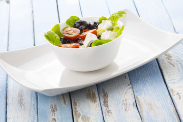 Greek salad kitchen blue wooden background
