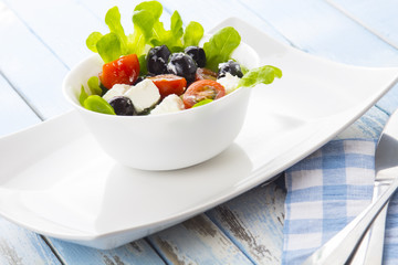Greek salad kitchen blue wooden background
