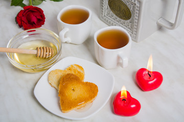Obraz na płótnie Canvas Easy breakfast for the Valentine's day with two piece of bread,