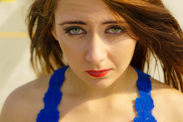 Closeup of woman making sad face