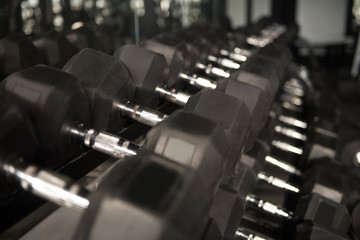Fototapeta na wymiar Rows Of Dumbbells In The Gym