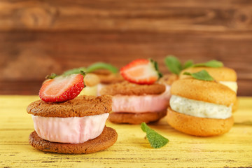 Ice cream cookie sandwiches on wooden table