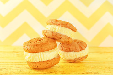 Ice cream cookie sandwiches on wall background