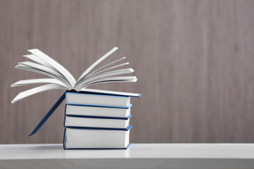 Pile of new books on table