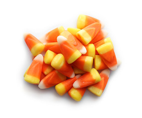 Colorful Halloween candies on white background