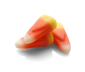 Colorful Halloween candies on white background