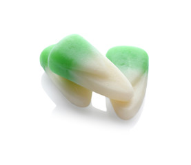 Colorful Halloween candies on white background