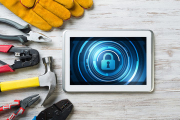 Web security and technology concept with tablet pc on wooden table © adam121
