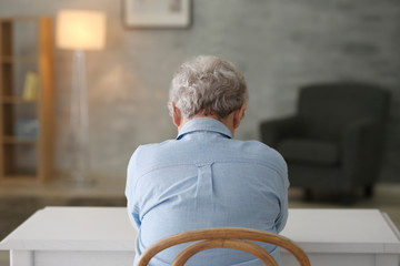 Depressed elderly woman at home
