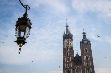 Fototapeta na wymiar Church on Krakow's market square with birds, Poland
