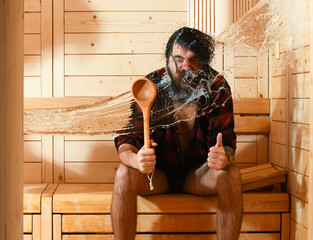 Excited man wet in sauna
