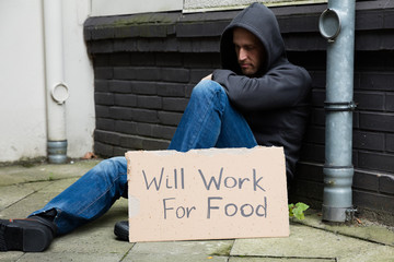 Sad Man With Signboard