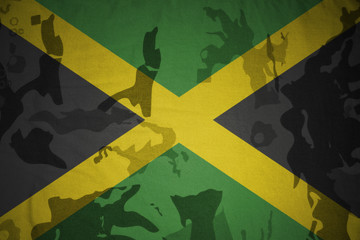 flag of jamaica on the khaki texture . military concept