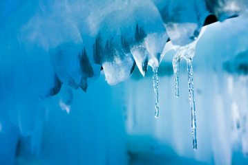 Naklejka na ściany i meble Vintage icicles background, melting icicles exposed to the sunsh