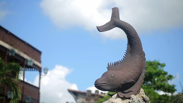 Fish statue closeup shot at sunny day