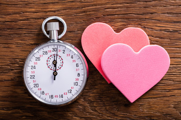Speed Dating Concept. Hearts And A Stop Watch © Andrey Popov