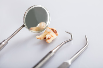 Decay Tooth With Dental Tools