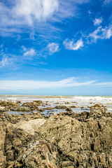 Fototapeta na wymiar rocks on the beach, sea background
