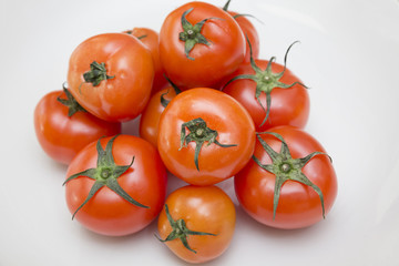 Fresh tomatoes with green leaf