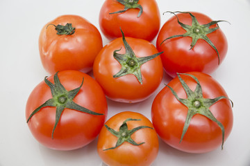 Fresh tomatoes with green leaf