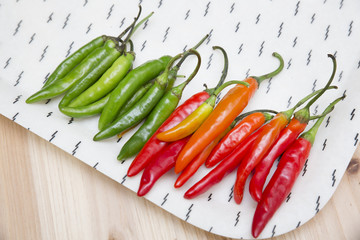 Fresh chili peppers on white tray