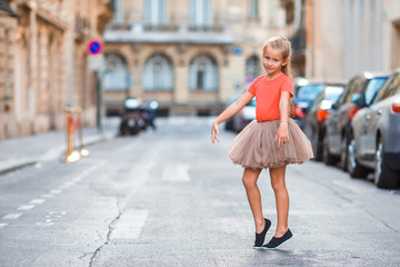 Adorable little girl during summer vacation in Paris. Amazing balerina enjoy her trip in France © travnikovstudio