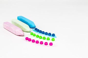 Three pieces of chalk with corresponding colored beads and color swatches