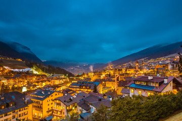 night view of mountain village in alpine valley