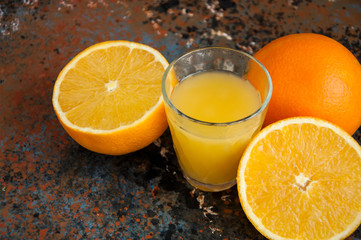 Orange and Tangerine Juice on Rusty Background