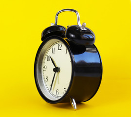 classic table clock on a yellow background. interior Features