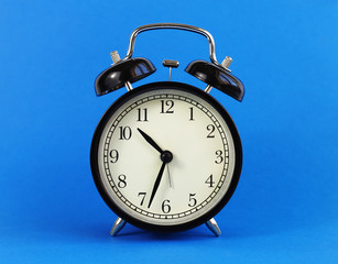 classic table clock on a blue background. interior Features
