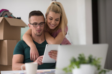 Young couple moving in a new home