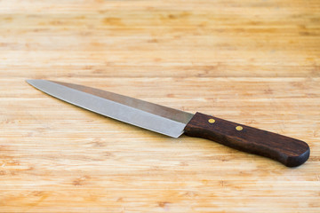 kitchen knifes on wooden board