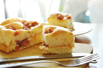 bread topping slice pork sausage cut for piece on wooden chop plate