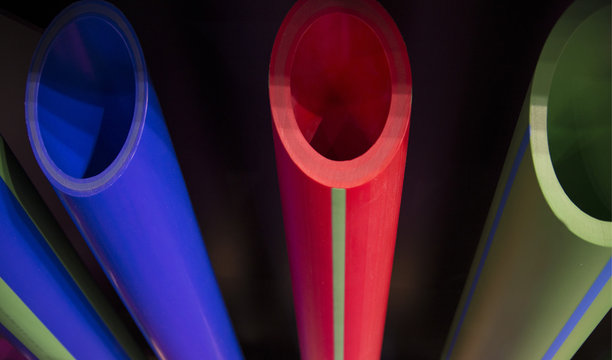 blue green and red plastic pipeline tubes