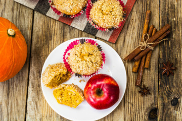 Fototapeta na wymiar Flavored muffins with pumpkin and apple
