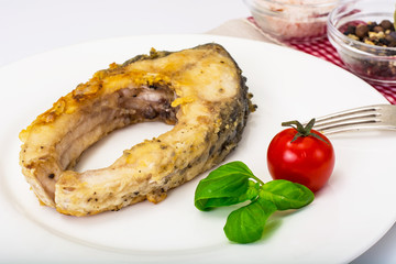 Fried breaded fish on a white background