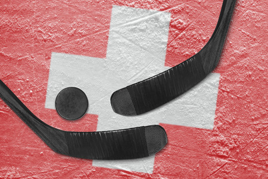 Swiss flag and two hockey sticks hockey
