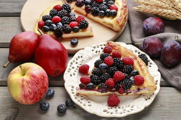 Piece of fruit tart with blackberries, raspberries and blueberri