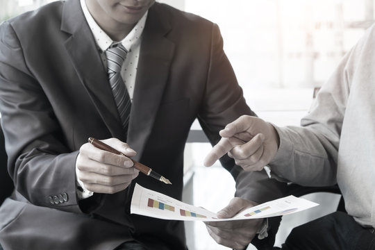 Business adviser analyzing financial figures denoting the progre