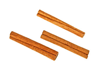 Cinnamon sticks on white background, top view