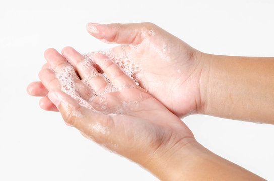 Hands washing with bubble soap.
