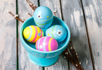 Four easter eggs in a cup