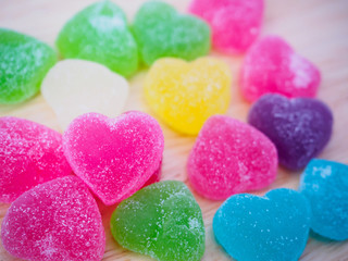 colorful hearts candy on wood for valentines background