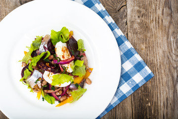 Salad with herring, beetroot, paprika, red onion, mustard and ba