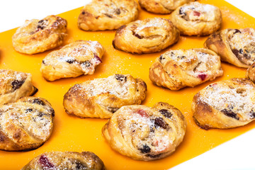Cookies of puff pastry with apple jam and raisins