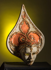 Beuaty Venetian mask isolated on black and yellow background